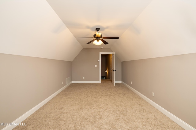 bonus room featuring light colored carpet, ceiling fan, and vaulted ceiling