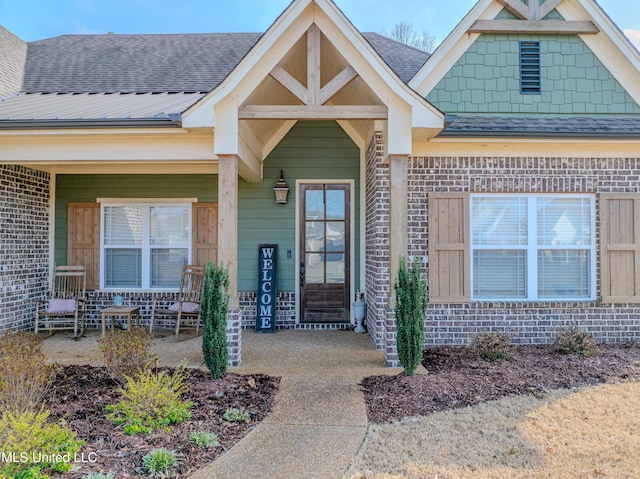 property entrance featuring covered porch