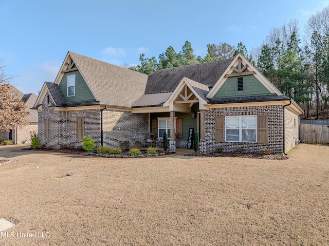 view of front of property featuring a porch and a front lawn