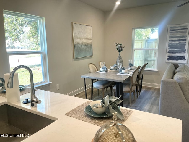 150 Debuys Rd, Biloxi, MS 39531 - dining space featuring baseboards and wood finished floors