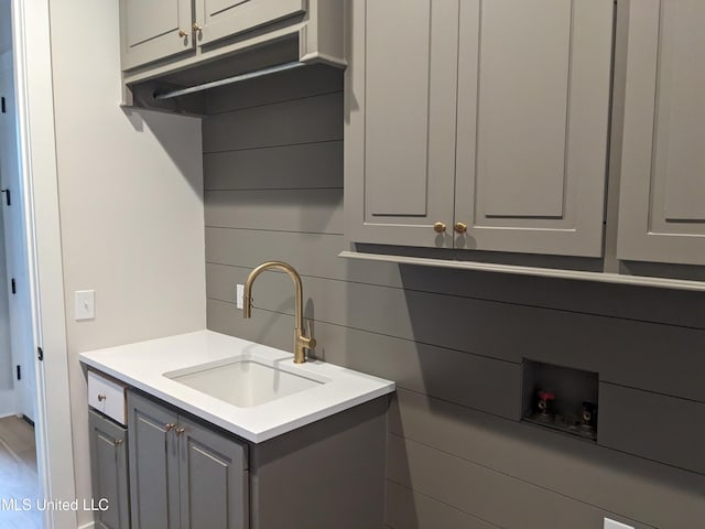 kitchen with gray cabinets and sink