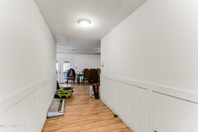 hall with light hardwood / wood-style floors