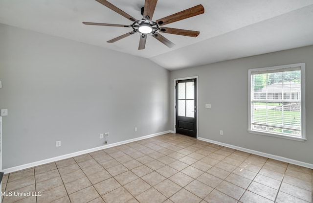 783 Whippoorwill Dr, Brandon, MS 39047 - empty room with vaulted ceiling, a ceiling fan, and light tile patterned flooring