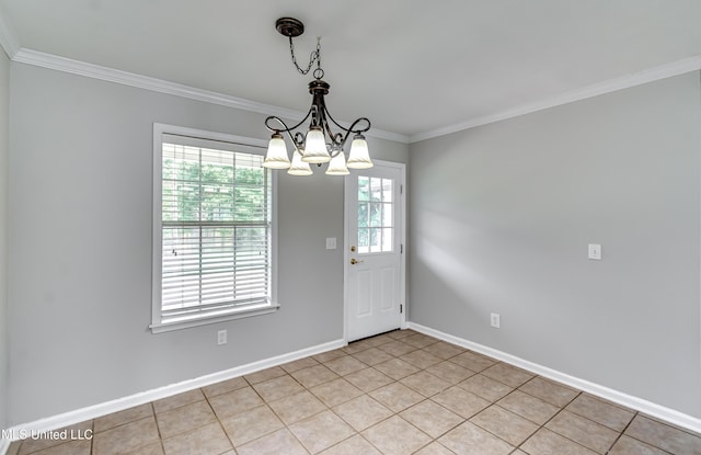 783 Whippoorwill Dr, Brandon, MS 39047 - unfurnished dining area with crown molding, a chandelier, and light tile patterned floors