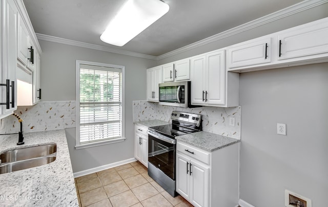 783 Whippoorwill Dr, Brandon, MS 39047 - kitchen featuring stainless steel appliances, decorative backsplash, white cabinets, crown molding, and light stone countertops
