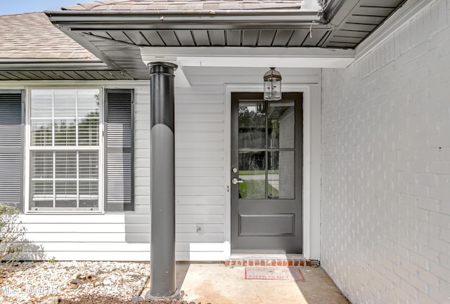 783 Whippoorwill Dr, Brandon, MS 39047 - view of exterior entry with a shingled roof