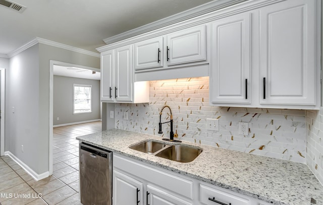 783 Whippoorwill Dr, Brandon, MS 39047 - kitchen featuring dishwasher, tasteful backsplash, white cabinetry, light tile patterned floors, and ornamental molding