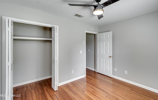 783 Whippoorwill Dr, Brandon, MS 39047 - unfurnished bedroom featuring a closet, wood finished floors, and a ceiling fan