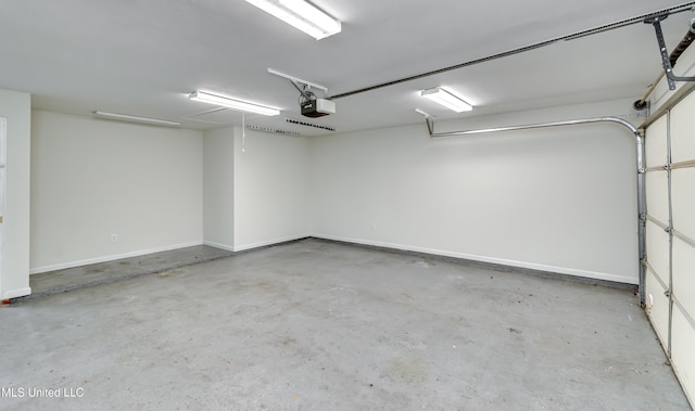 783 Whippoorwill Dr, Brandon, MS 39047 - garage with a garage door opener and baseboards