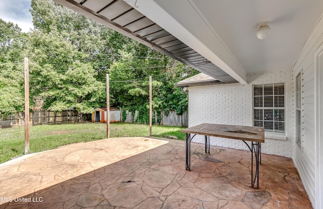 783 Whippoorwill Dr, Brandon, MS 39047 - fenced backyard featuring a storage unit and a patio