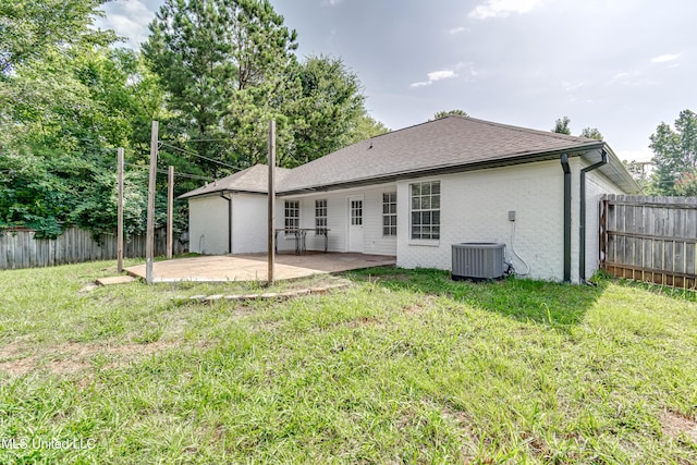 783 Whippoorwill Dr, Brandon, MS 39047 - rear view of house with a patio area, a fenced backyard, brick siding, and roof with shingles