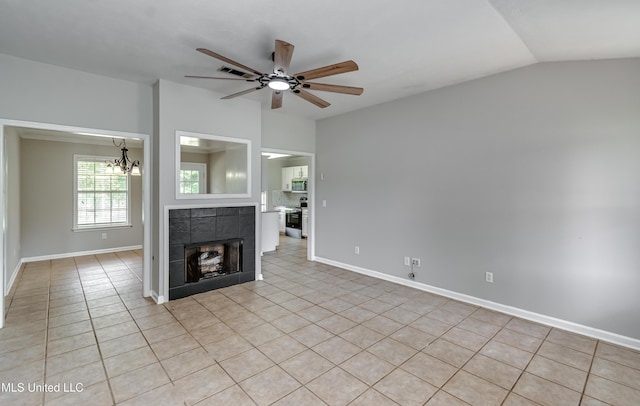 783 Whippoorwill Dr, Brandon, MS 39047 - unfurnished living room with ceiling fan, vaulted ceiling, light tile patterned flooring, a chandelier, and a fireplace