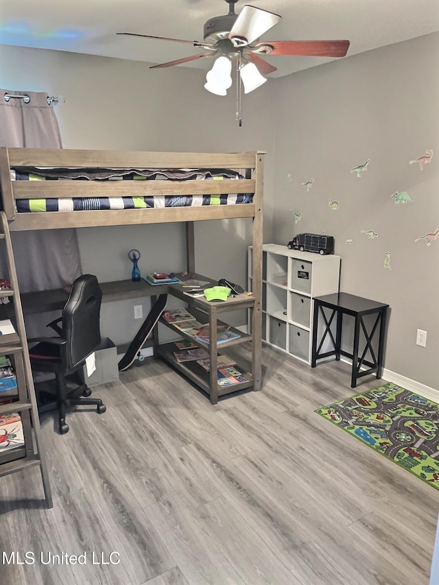 8617 Pinoak Ln, Ocean Springs, MS 39564 - bedroom with wood finished floors, an office area, and a ceiling fan