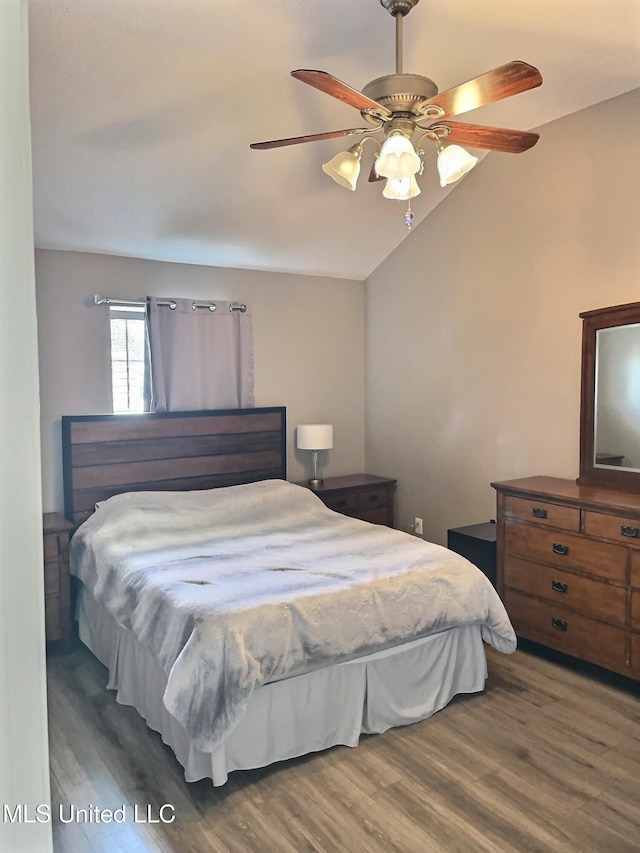 8617 Pinoak Ln, Ocean Springs, MS 39564 - bedroom featuring lofted ceiling, wood finished floors, and a ceiling fan