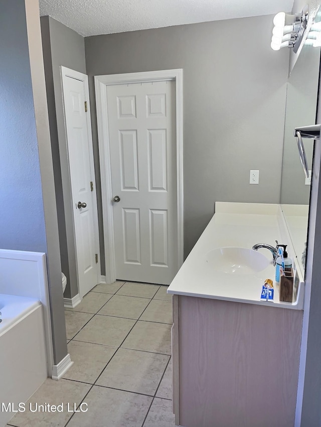 8617 Pinoak Ln, Ocean Springs, MS 39564 - bathroom featuring vanity, a bath, and tile patterned floors
