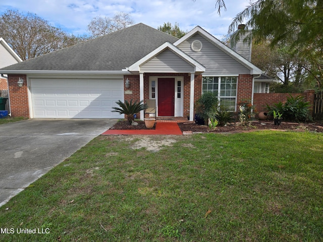 view of front of home featuring a front lawn and a garage