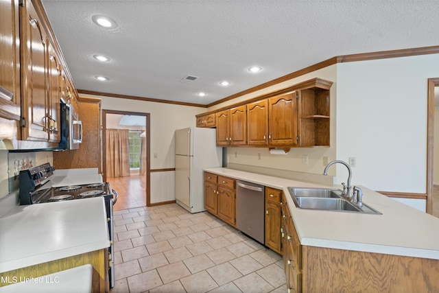 kitchen featuring a textured ceiling, sink, ornamental molding, and stainless steel appliances