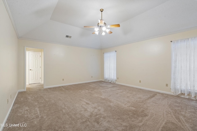 spare room with ceiling fan, light colored carpet, ornamental molding, and lofted ceiling