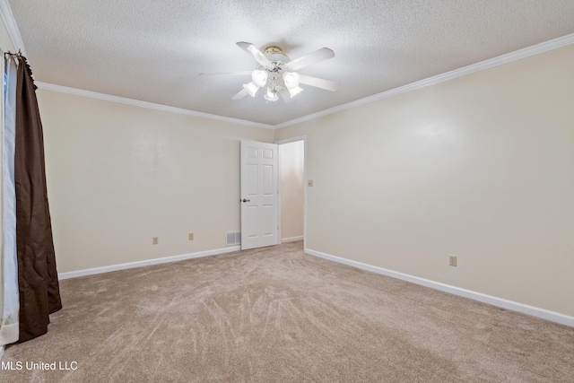 unfurnished room featuring light colored carpet, a textured ceiling, and ornamental molding