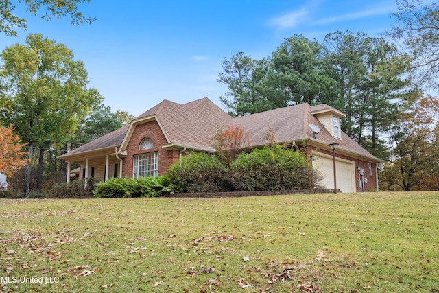 view of front property featuring a front yard and a garage