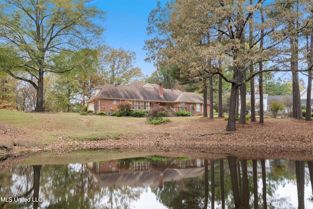 rear view of house with a water view