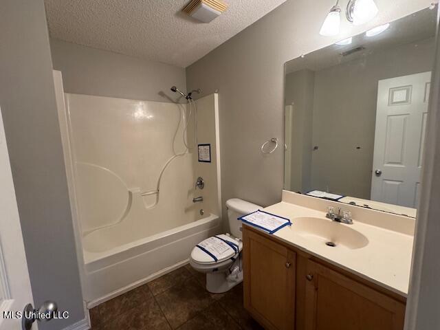 bathroom with visible vents, toilet,  shower combination, a textured ceiling, and vanity