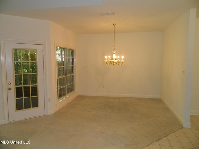 7890 Hilo Way, Diamondhead, MS 39525 - unfurnished dining area featuring a chandelier, carpet flooring, baseboards, and tile patterned floors