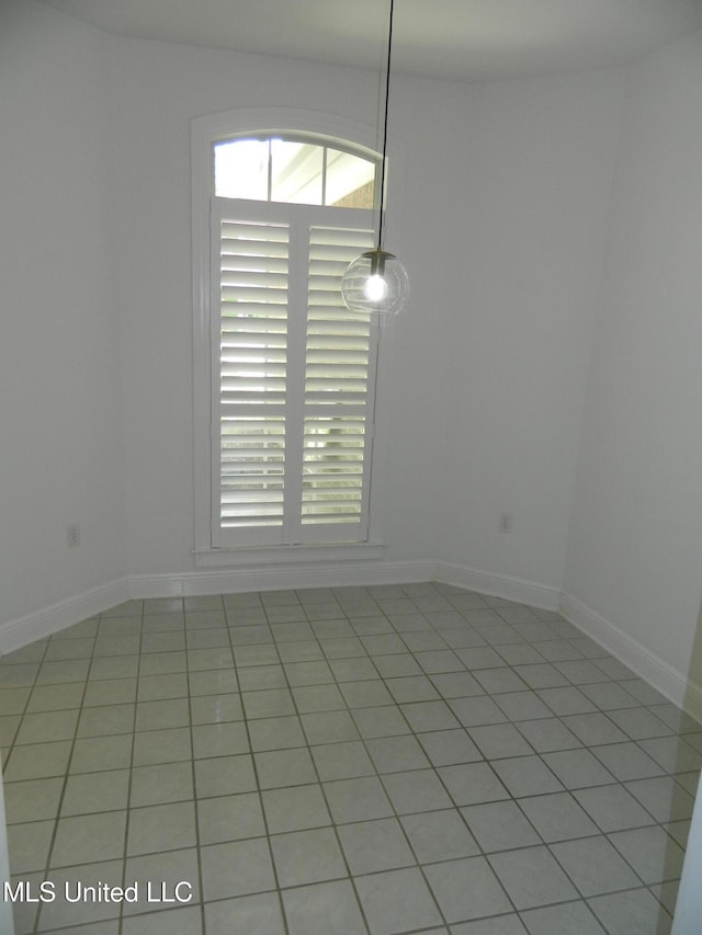 7890 Hilo Way, Diamondhead, MS 39525 - unfurnished room featuring healthy amount of natural light, light tile patterned floors, and baseboards