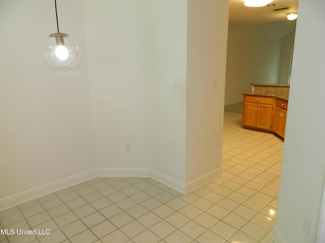 7890 Hilo Way, Diamondhead, MS 39525 - unfurnished dining area featuring light tile patterned floors and baseboards