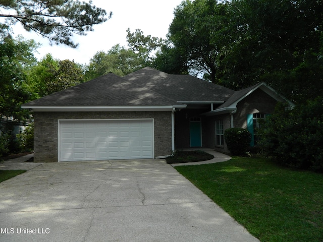 7890 Hilo Way, Diamondhead, MS 39525 - single story home with driveway, brick siding, an attached garage, a front lawn, and a shingled roof