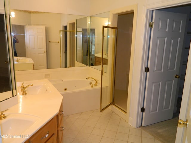 7890 Hilo Way, Diamondhead, MS 39525 - bathroom featuring tile patterned floors, a stall shower, a jetted tub, and double vanity