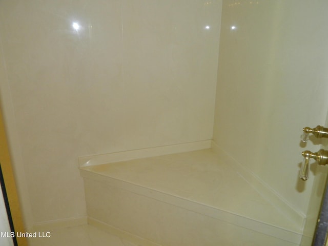 7890 Hilo Way, Diamondhead, MS 39525 - bathroom featuring a shower and baseboards