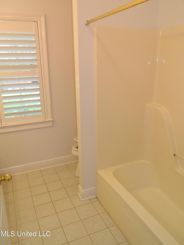 7890 Hilo Way, Diamondhead, MS 39525 - full bath featuring tile patterned flooring, toilet, shower / bathtub combination, and baseboards