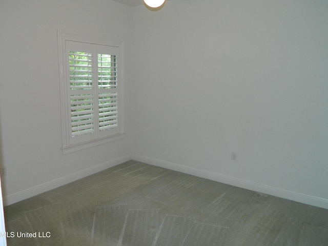 7890 Hilo Way, Diamondhead, MS 39525 - spare room featuring carpet floors and baseboards
