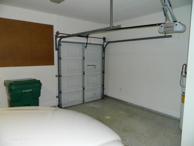 7890 Hilo Way, Diamondhead, MS 39525 - garage with a garage door opener and baseboards
