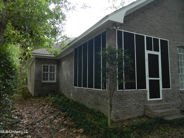 7890 Hilo Way, Diamondhead, MS 39525 - view of side of property featuring entry steps and brick siding