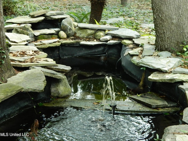 7890 Hilo Way, Diamondhead, MS 39525 - exterior view of a small pond