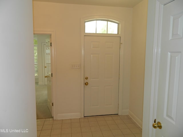7890 Hilo Way, Diamondhead, MS 39525 - entrance foyer featuring healthy amount of natural light, baseboards, and light tile patterned flooring