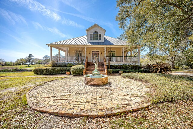 1401 Ladnier Rd, Gautier, MS 39553 - view of front of property with metal roof and a porch