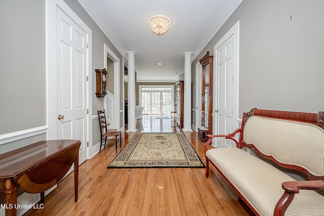 1401 Ladnier Rd, Gautier, MS 39553 - foyer entrance with ornate columns, recessed lighting, crown molding, and light wood finished floors