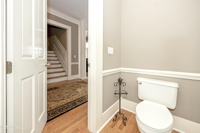1401 Ladnier Rd, Gautier, MS 39553 - half bathroom featuring toilet, baseboards, and wood finished floors