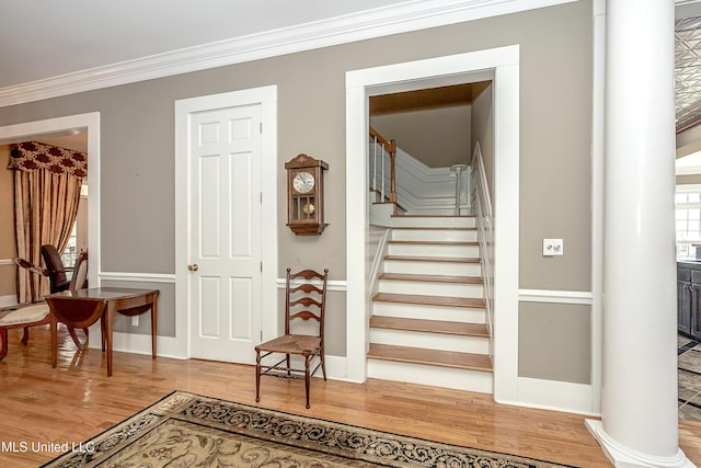 1401 Ladnier Rd, Gautier, MS 39553 - stairway featuring baseboards, wood finished floors, and ornamental molding