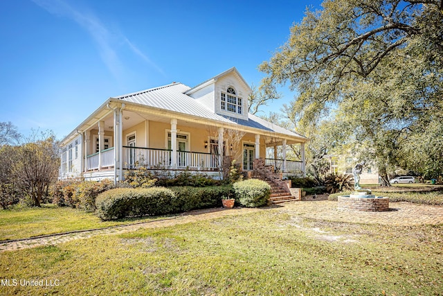 1401 Ladnier Rd, Gautier, MS 39553 - farmhouse with a front yard and a porch