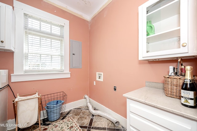 1401 Ladnier Rd, Gautier, MS 39553 - laundry room with electric panel, hookup for an electric dryer, baseboards, cabinet space, and hookup for a washing machine