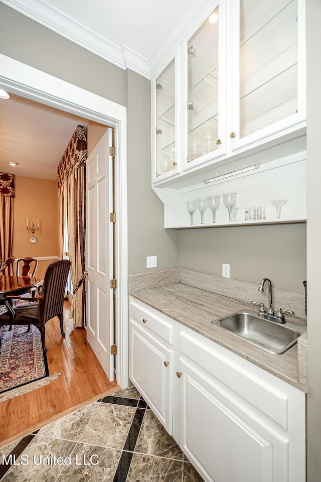 1401 Ladnier Rd, Gautier, MS 39553 - bar featuring ornamental molding and a sink