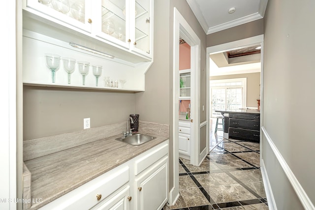 1401 Ladnier Rd, Gautier, MS 39553 - bar with wet bar, a sink, ornamental molding, and baseboards