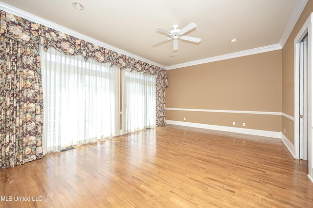 1401 Ladnier Rd, Gautier, MS 39553 - spare room featuring ornamental molding, baseboards, visible vents, ceiling fan, and wood finished floors
