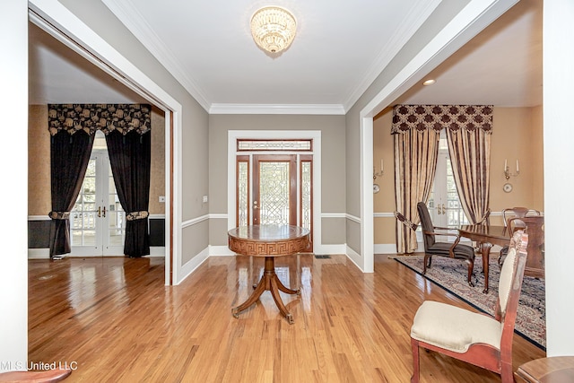 1401 Ladnier Rd, Gautier, MS 39553 - foyer with french doors, light wood-style floors, and a wealth of natural light
