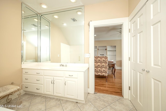 1401 Ladnier Rd, Gautier, MS 39553 - bathroom featuring vanity, crown molding, recessed lighting, tile patterned floors, and visible vents