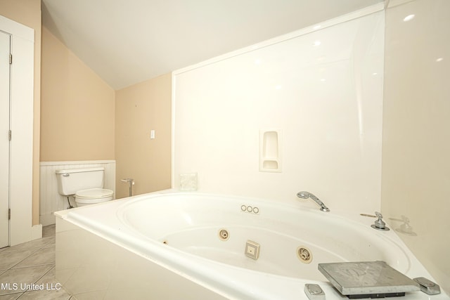 1401 Ladnier Rd, Gautier, MS 39553 - bathroom with a whirlpool tub, vaulted ceiling, toilet, and tile patterned flooring
